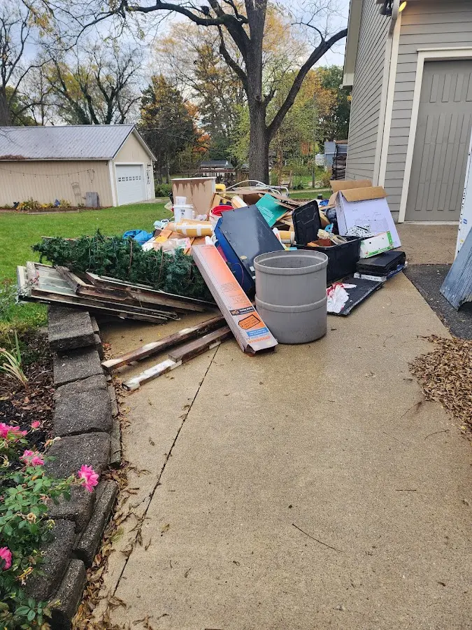 Dumpster being loaded with debris for Commercial Dumpster Rental in West Caldwell